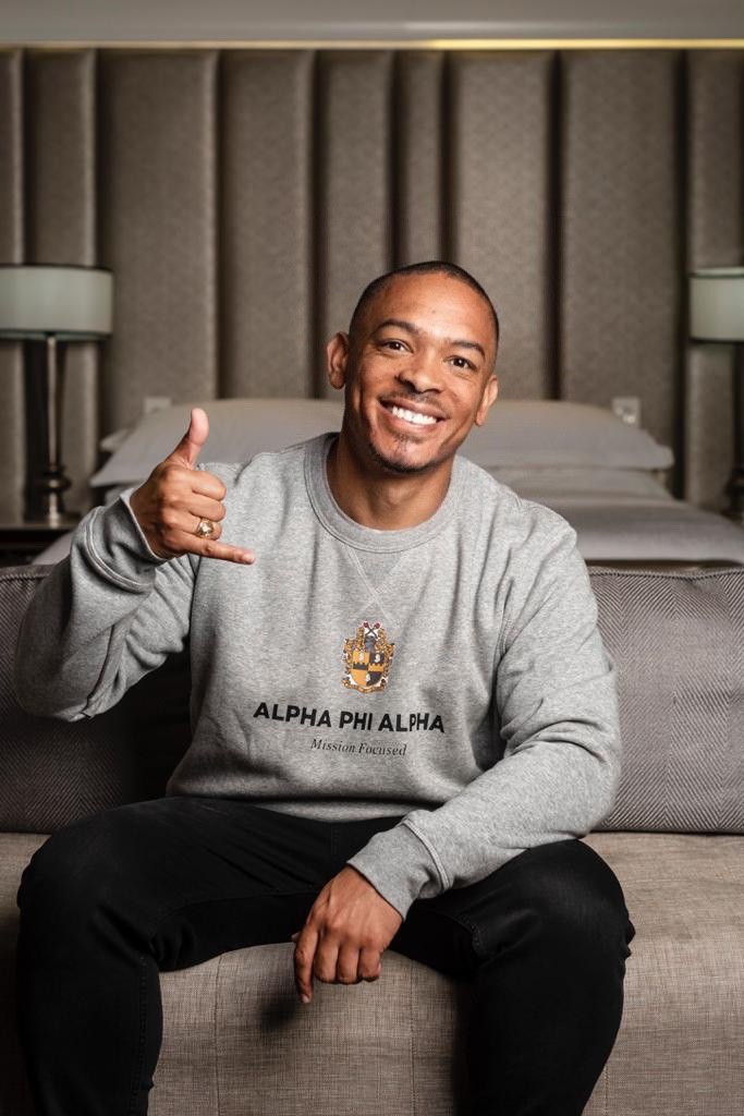 Arthur Wade Anderson smiling in an Alpha Phi Alpha sweater